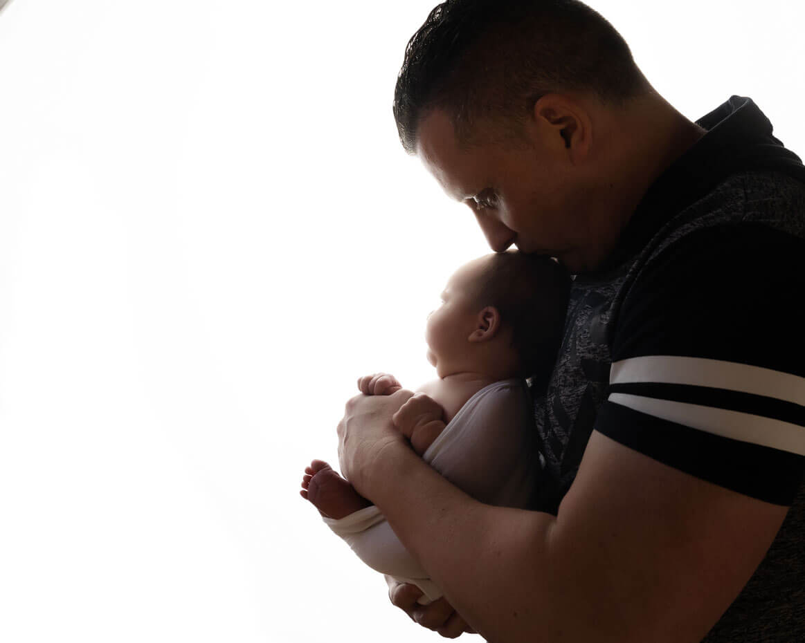 dad with newborn baby photography