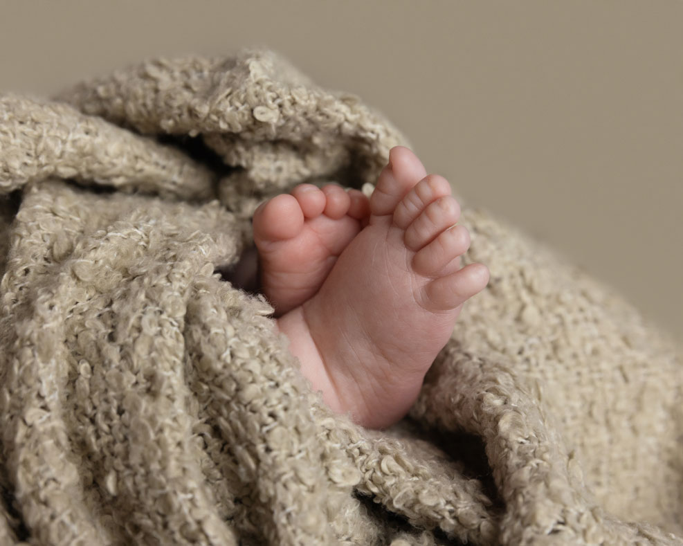 newborn baby with tiny feet