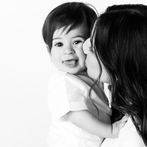 VIP Family Sessions Candid Mum kissing baby portrait at Kristy’s Studio, Blue Mountains — relaxed, joyful moment
